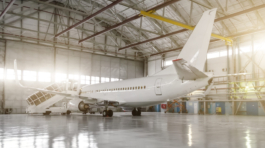 The,Airplane,In,The,Hangar,,Behind,The,Whole,Plane,And