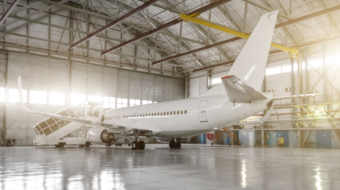 The,Airplane,In,The,Hangar,,Behind,The,Whole,Plane,And