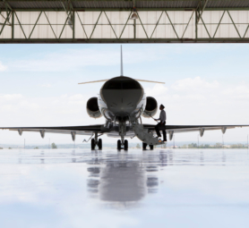 Pilot,Boarding,Private,Jet,In,Hangar